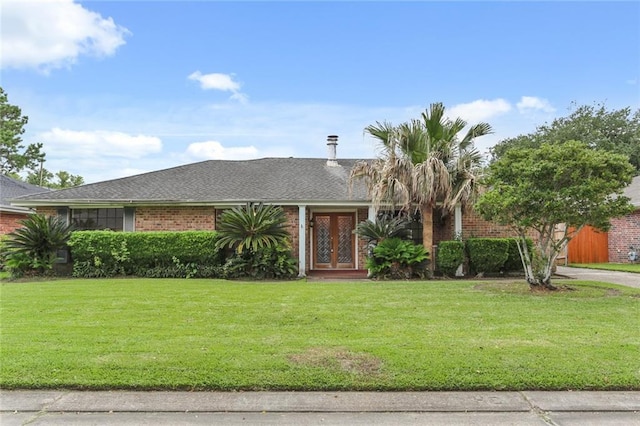 ranch-style home featuring a front lawn