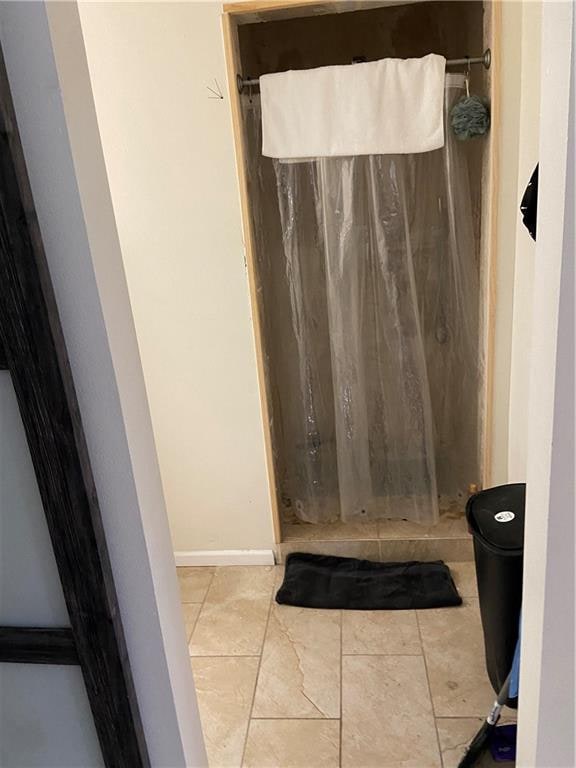 bathroom featuring tile flooring