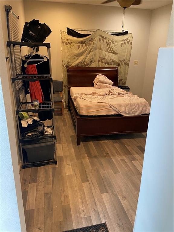 bedroom with hardwood / wood-style floors