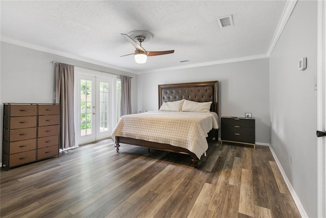 bedroom featuring dark hardwood / wood-style floors, ceiling fan, access to exterior, and a textured ceiling