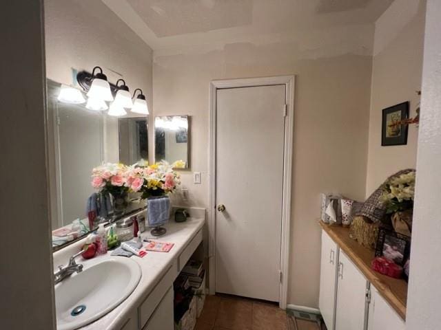 bathroom with tile floors and large vanity