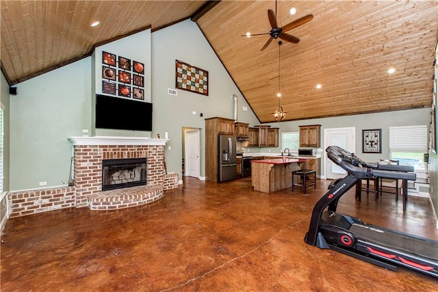 exercise room featuring high vaulted ceiling, ceiling fan, and wood ceiling