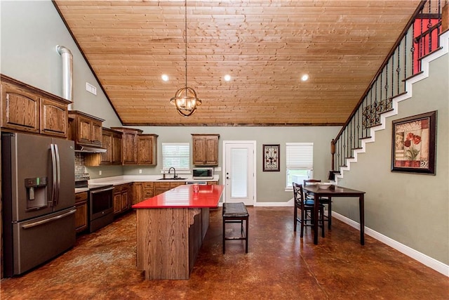 kitchen with an inviting chandelier, a kitchen island, high vaulted ceiling, sink, and appliances with stainless steel finishes