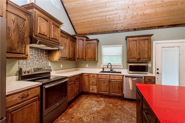 kitchen featuring sink, tasteful backsplash, vaulted ceiling, and stainless steel appliances