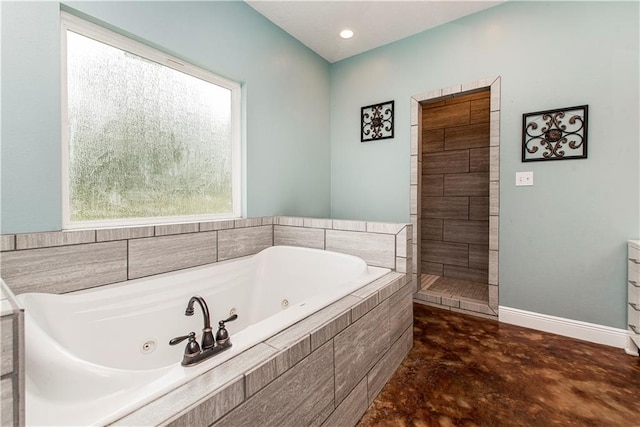 bathroom with tiled tub