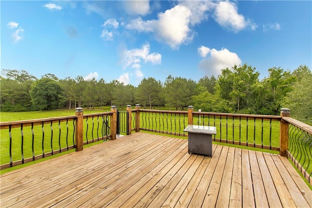 wooden deck with a lawn