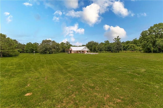 view of yard with a rural view