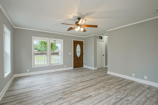 interior space with a wealth of natural light, hardwood / wood-style floors, and ceiling fan