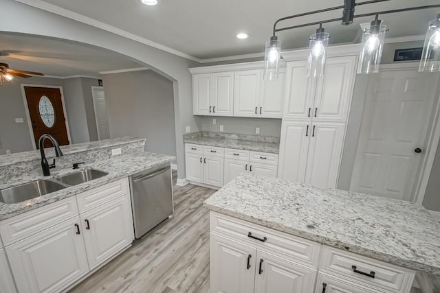 kitchen featuring dishwasher, ceiling fan, crown molding, white cabinets, and sink