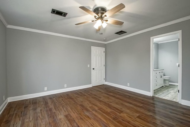 unfurnished bedroom with ornamental molding, dark hardwood / wood-style floors, ensuite bathroom, and ceiling fan