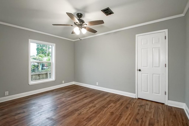 unfurnished room with dark wood-type flooring, ornamental molding, and ceiling fan