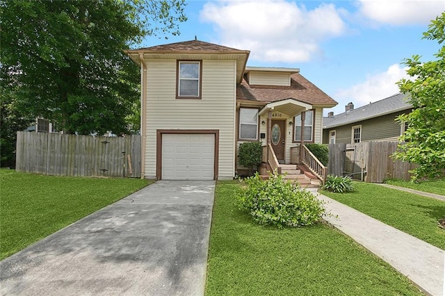 split level home featuring a garage and a front lawn