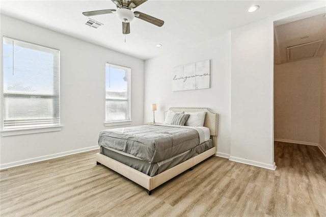 bedroom featuring light hardwood / wood-style floors and ceiling fan