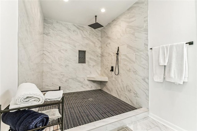 bathroom featuring a tile shower