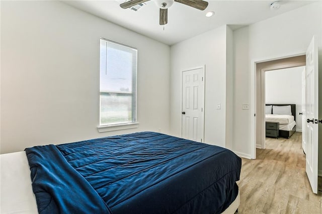 bedroom featuring light hardwood / wood-style flooring and ceiling fan