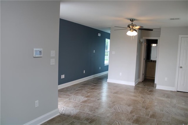 spare room with ceiling fan