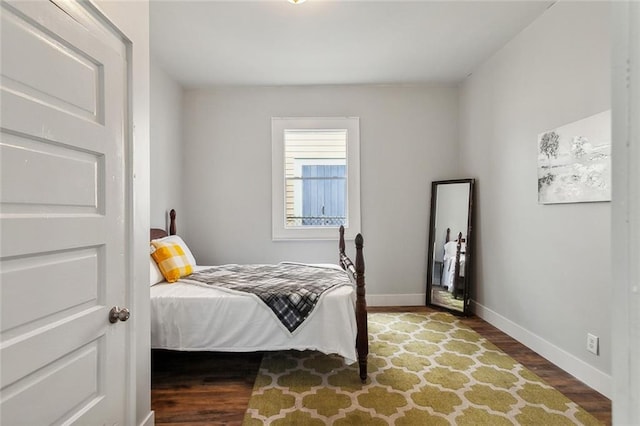 bedroom featuring dark wood-type flooring