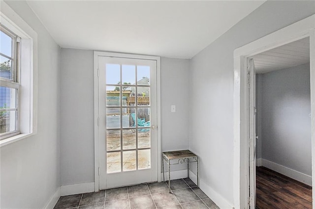 spare room with a wealth of natural light and hardwood / wood-style flooring