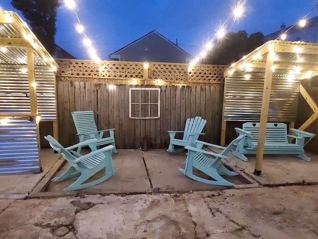 patio terrace at night with a pergola