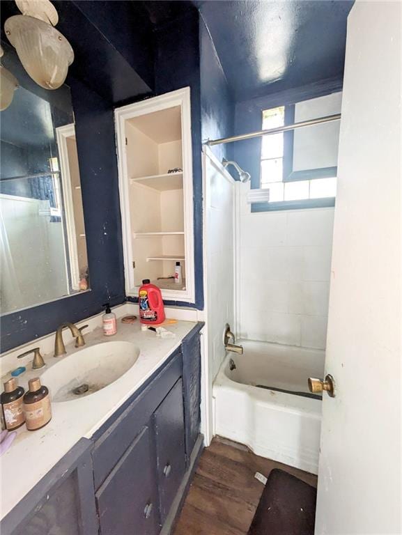 bathroom with shower / bath combination, vanity, and hardwood / wood-style flooring