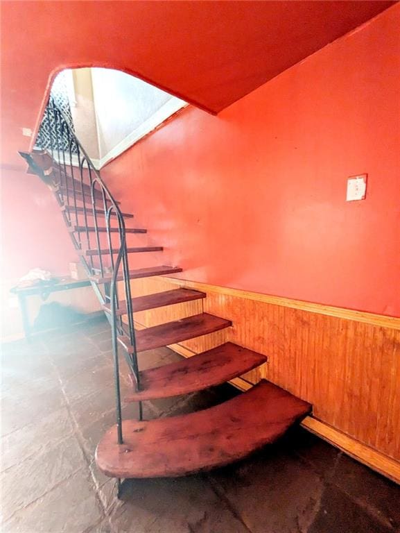 staircase featuring tile patterned flooring