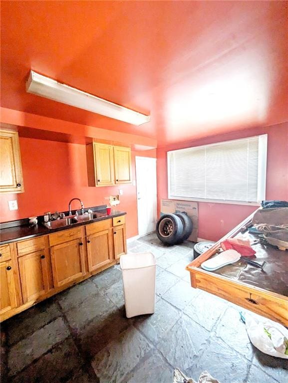 kitchen with sink and light tile patterned flooring