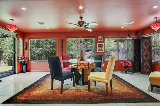 dining space featuring plenty of natural light, ceiling fan, and light tile patterned floors