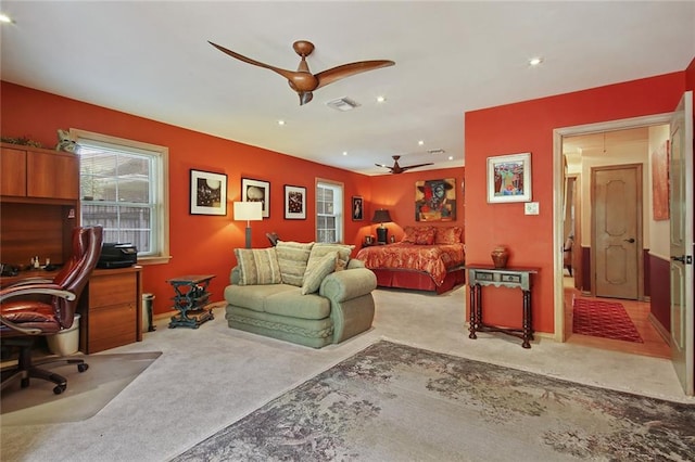 bedroom featuring ceiling fan and light carpet