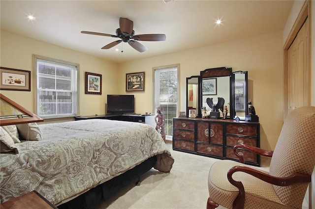 bedroom featuring carpet, ceiling fan, and a closet