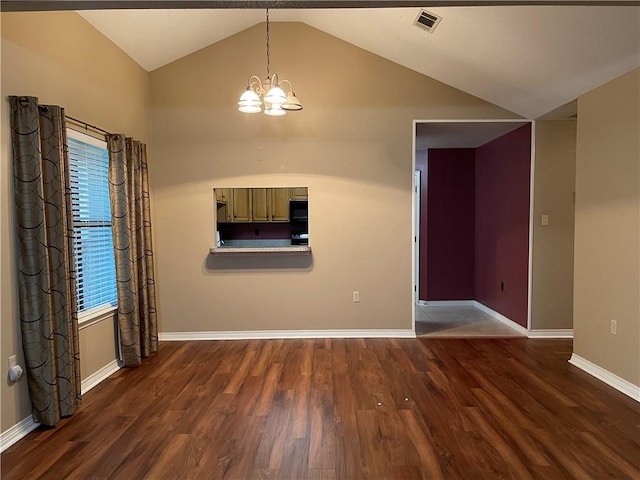 empty room featuring high vaulted ceiling, a notable chandelier, and dark hardwood / wood-style floors