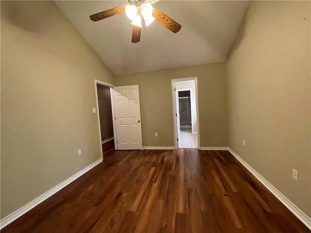 unfurnished bedroom featuring hardwood / wood-style floors, a spacious closet, ceiling fan, and lofted ceiling