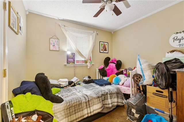 bedroom with a textured ceiling, ornamental molding, carpet flooring, and ceiling fan