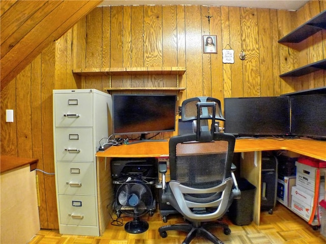 office area featuring light parquet flooring and wooden walls