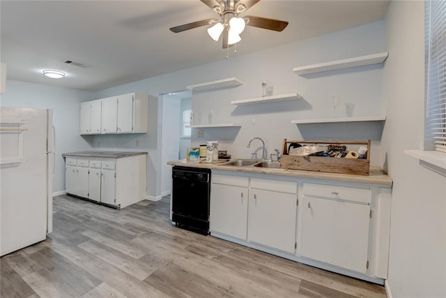 kitchen with white refrigerator, white cabinets, light hardwood / wood-style flooring, dishwasher, and sink