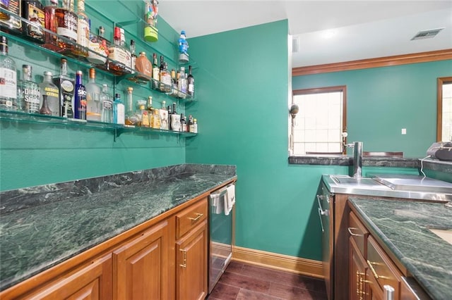 bar with dark hardwood / wood-style floors, wine cooler, and crown molding