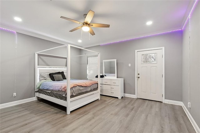 bedroom with light hardwood / wood-style floors and ceiling fan