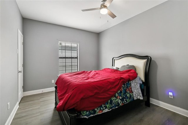 bedroom with ceiling fan and hardwood / wood-style flooring