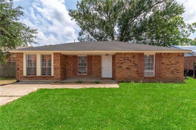 ranch-style house with a front lawn