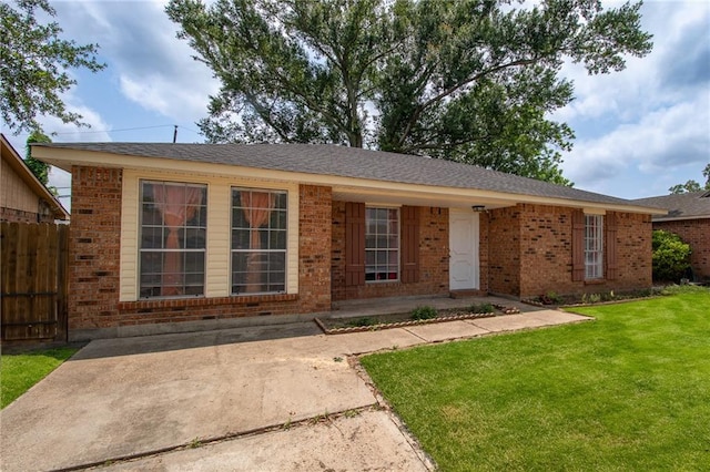 ranch-style house with a front lawn