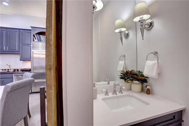 bathroom featuring tile flooring and vanity