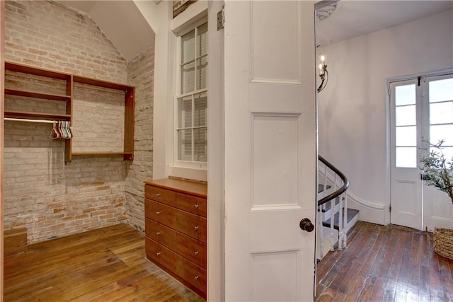 walk in closet featuring vaulted ceiling and hardwood / wood-style floors