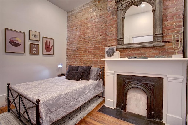 bedroom with hardwood / wood-style flooring