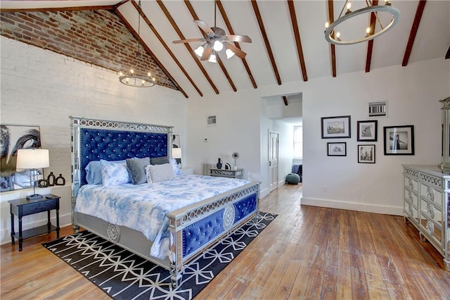 bedroom featuring high vaulted ceiling, ceiling fan with notable chandelier, hardwood / wood-style flooring, and beam ceiling