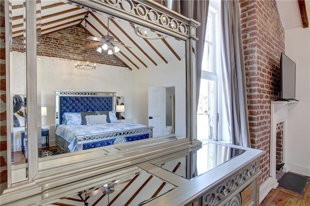 bedroom with beamed ceiling, high vaulted ceiling, wood-type flooring, and ceiling fan