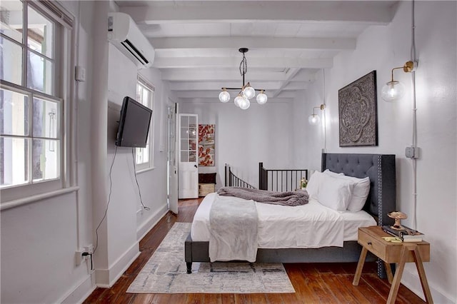 bedroom with dark hardwood / wood-style floors and multiple windows