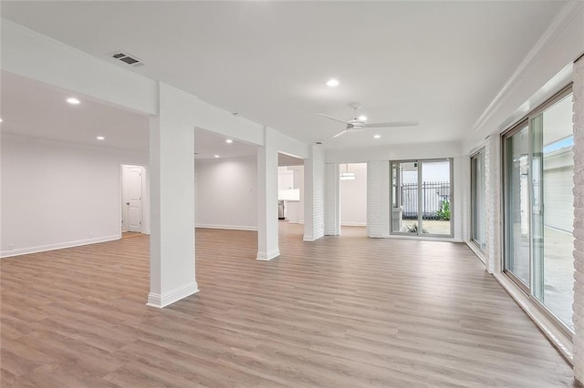 unfurnished living room with ceiling fan, light hardwood / wood-style floors, and ornamental molding