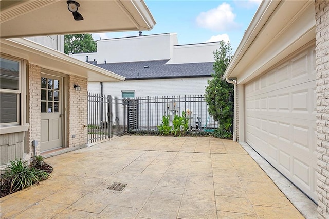 view of patio / terrace featuring a garage