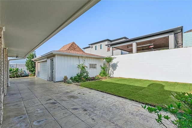 view of patio / terrace featuring a garage