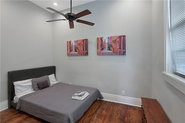 bedroom featuring dark hardwood / wood-style floors and ceiling fan