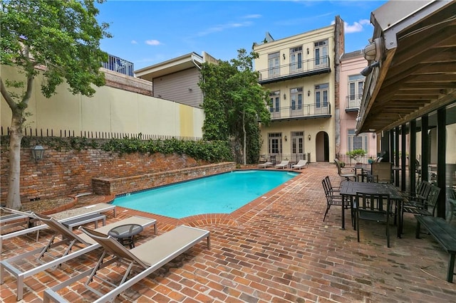 view of swimming pool featuring a patio